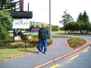 Writer in front of Lake Plaza Hotel signboard