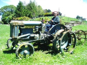 Writer on a broken-down farm tractor