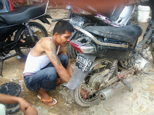A Roadside Motorcycle Repairer