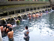 Hindu devotees bathing with "holy water"