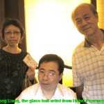 Writer and his wife posing with the artist, Gong Liang