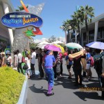 Long queue in hot sun outside "Astro Blasters"