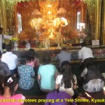 Buddhists devotees praying at Yele Pagoda