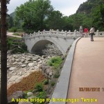 A stone bridge over a dry river