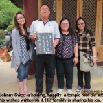 Johnny Swee and family make a temple donation