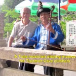 A Tujia musician playing musics for climbers