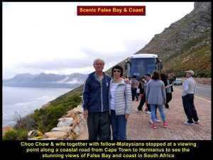 Choo Chaw and wife together with others at a lookout point to see scenic False Bay and coasts
