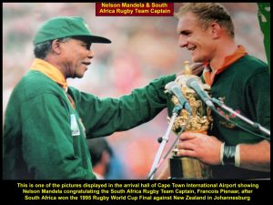 A picture of Nelson Mandela congratulating the S. Africa rugby team captain for winning the 1995 Rugby World Cup Final