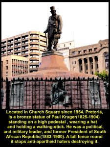 Statue of Paul Kruger holding a walking-stick and wearing a hat on a high plinth at the centre of Church Square