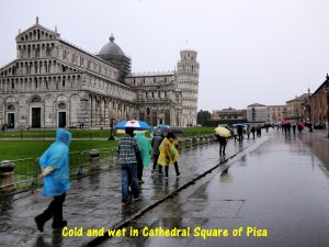 Cold and wet in Cathedral Square of Pisa
