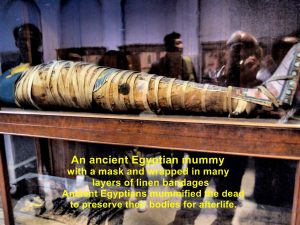 A mummy with a mask and wrapped in linen bandages