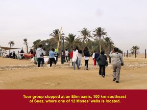 Tour group stopping at an Elim oasis to see one of 12 Moses' wells