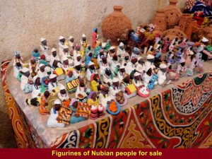A souvenir stall selling figurines of Nubian people