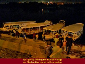 Tour group leaving the Nubian village in a motor-boat