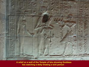 A relief at the Temple of Isis showing Goddess Isis watching a priest treating a sick person