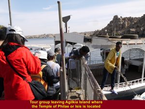 Tour group leaving Agilkia Island by boat