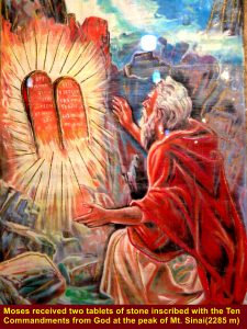 Moses on the Mi. Sinai summit receiving two tablets of stone inscribed with the God's Ten Commandments, according to the Book of Exodus