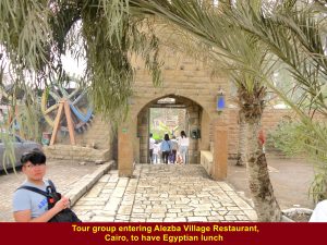 Tour group entering Alezba Village Restaurant in Cairo to have Egyptian lunch