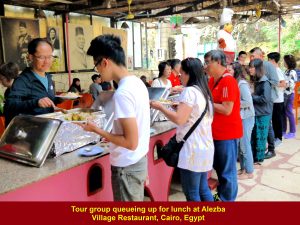 Tour members queuing up for buffet lunch at Alezba Village Restaurant, Cairo