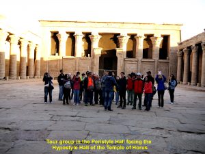 Tour group in Peristyle Hall facing the Hypostyle Hall of the Temple of Horus