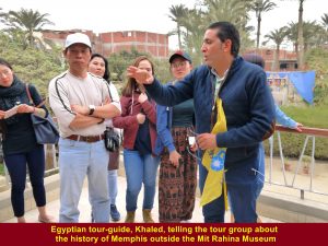 Egyptian tour-guide, Khaled, telling the tour group about the history of Memphis outside the Mit Rahina Museum