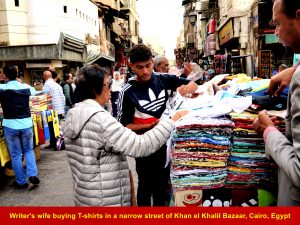 Writer;s wife buying T-shirts at Khan el Khalil Bazaar, Cairo