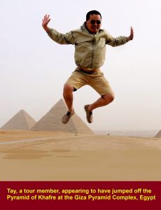 Tay, a tour member, appearing to have jumped off a pyramid