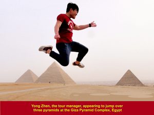 Yong Zhen, the tour manager, appearing to jump over three pyramids