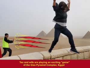 Tan and wife playing an exciting "game" at the Giza Pyramid Complex, Egypt